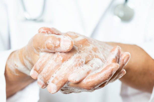 istock Doctor Washing His Hands 1213642538