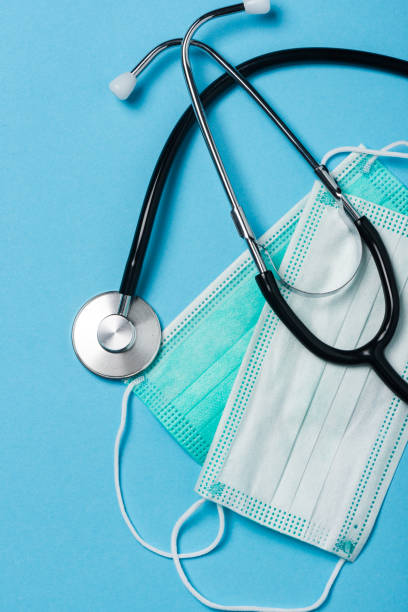 istock Coronavirus Pandemic Outbreak Related Items. Surgical Mask Doctor Stethoscope 1213643847