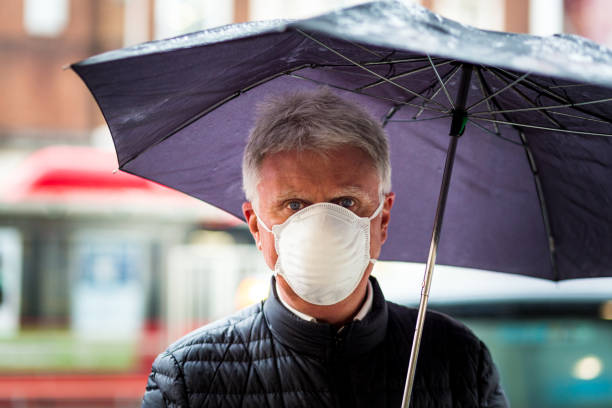 istock Senior man wearing protective face mask outdoors in the city 1213646225