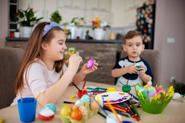 istock Children painting Easter eggs stock photo 1213646447