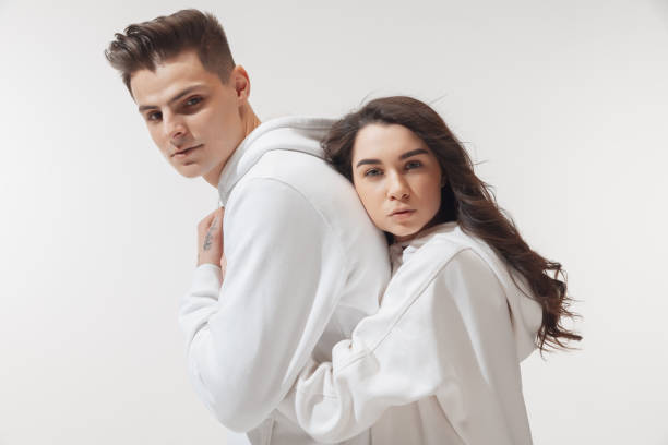 istock Trendy fashionable couple isolated on white studio background 1213646450