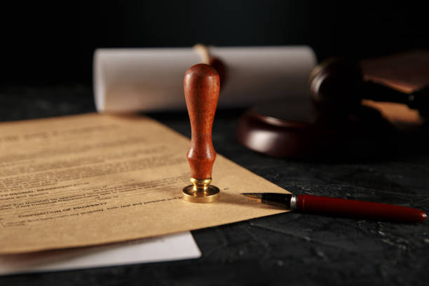 istock Notary's public pen and stamp on testament and last will. Notary public tools 1213647744