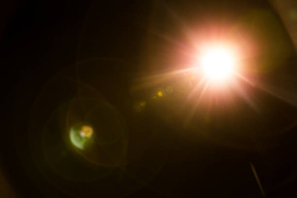 istock Abstract Natural Sun flare on the black 1213649614
