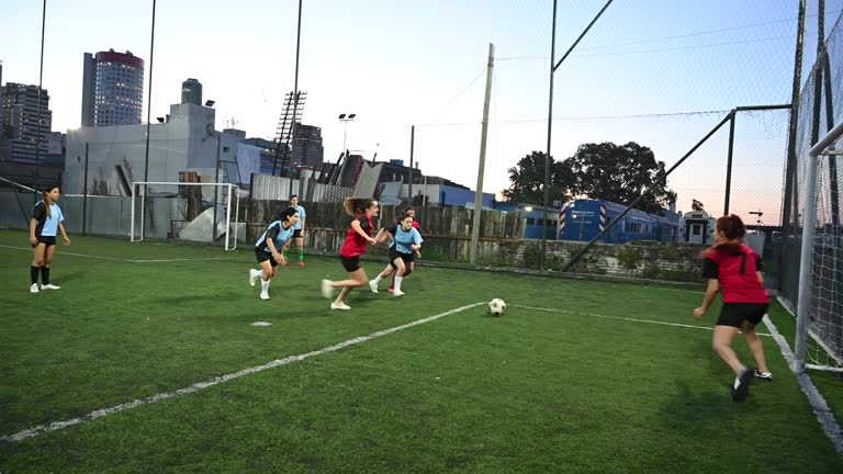 Female footballers in 20s and 30s playing practice match