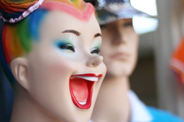 Laughing and smiling woman figurine in clothing store, good mood.