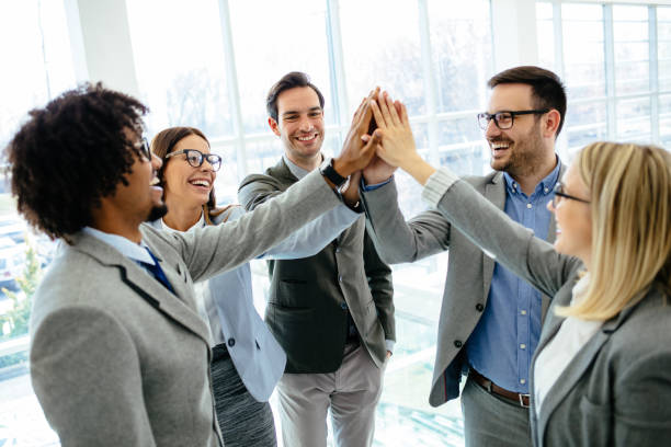 istock Excited business team give high five celebrating corporate success 1213655430
