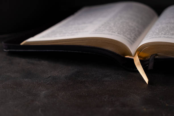 istock The Holy bible on dark background. Christianity concept. 1213655717