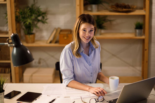 istock Young woman doing finances at home using laptop 1213656495
