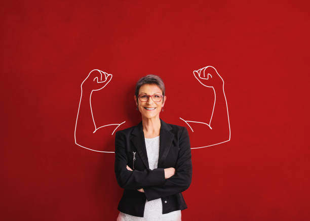 an adult woman shows strength - leadership business women senior adult imagens e fotografias de stock