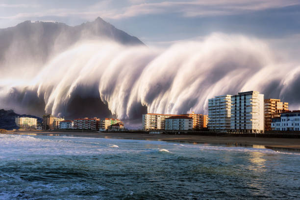 tsunami met een grote golf die op kusthuizen neerstort - tsunami stockfoto's en -beelden
