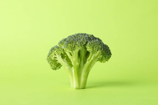 istock Broccoli on green background, space for text. Healthy food 1213657272