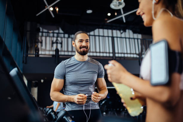 istock Couple taking a break after workout at gym 1213657970