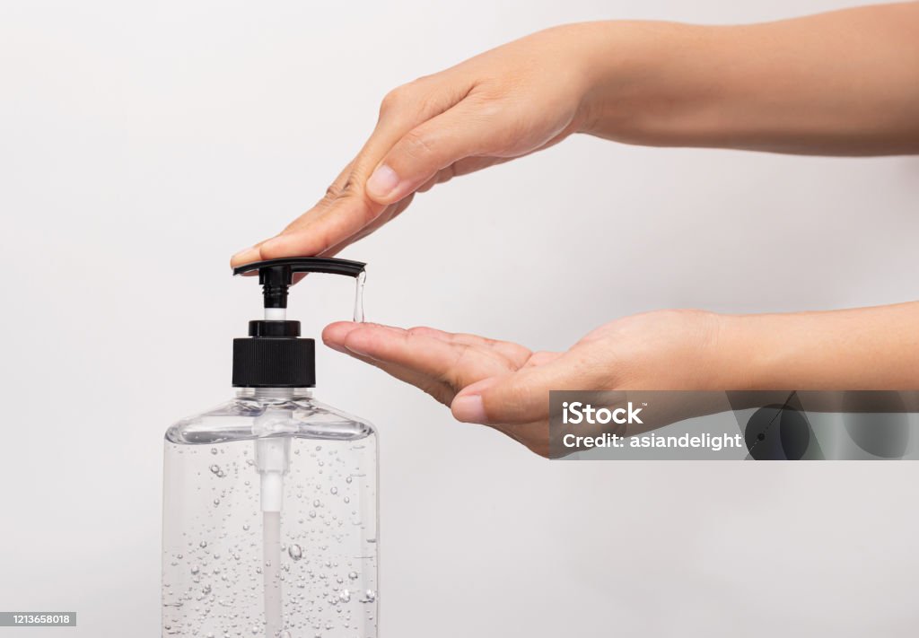 personal hygiene. people washing hand by hand sanitizer alcohol gel for cleaning and disinfection, prevention of spreading of germs during infections of COVID-19 Coronavirus outbreak situation Hand Sanitizer Stock Photo