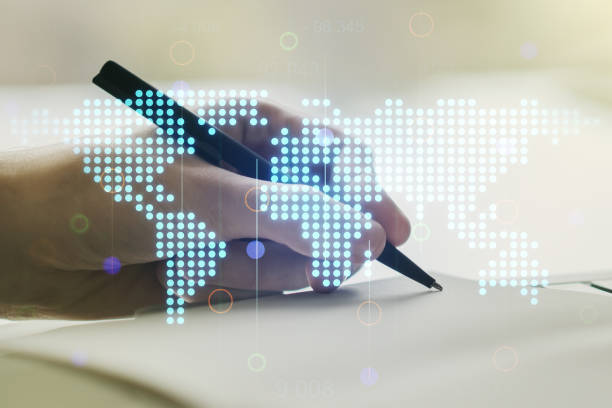 istock Double exposure of abstract digital world map and man hand writing in notebook on background, research and strategy concept 1213658518