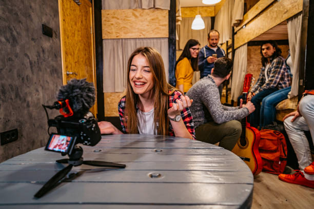 istock Woman vlogging from her hostel room 1213661181