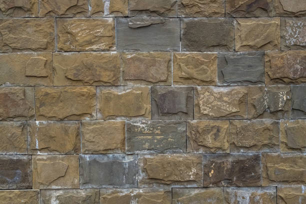 istock background - wall decoration with large bricks of different sizes. 1213665920
