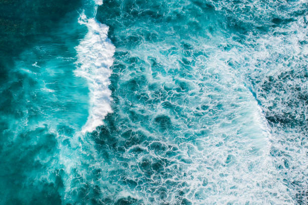 istock Big ocean waves hitting a coral rif. View from above. 1213665944