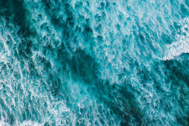 istock Big ocean waves hitting a coral rif. View from above. 1213665959