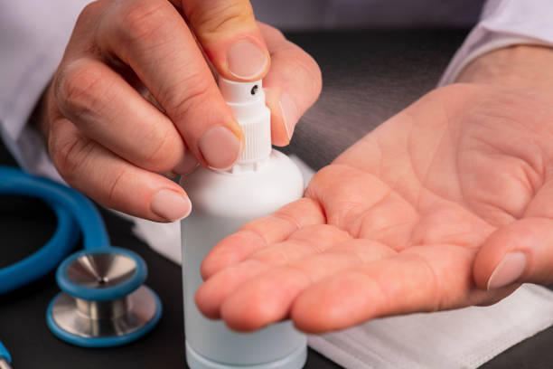 istock Doctor Cleaning Hands with Disinfection 1213666264