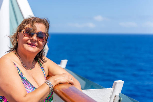 istock Senior Hispanic woman at sea 1213669565