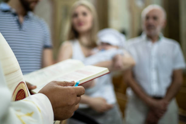 Parents and his son on baptism celebration at church