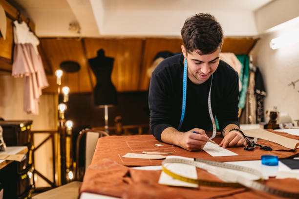 istock Fashion designer working in atelier 1213673131