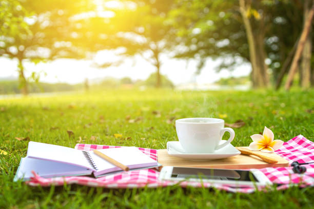 Picnic coffee setting on grass In the morning, relaxing on holiday.