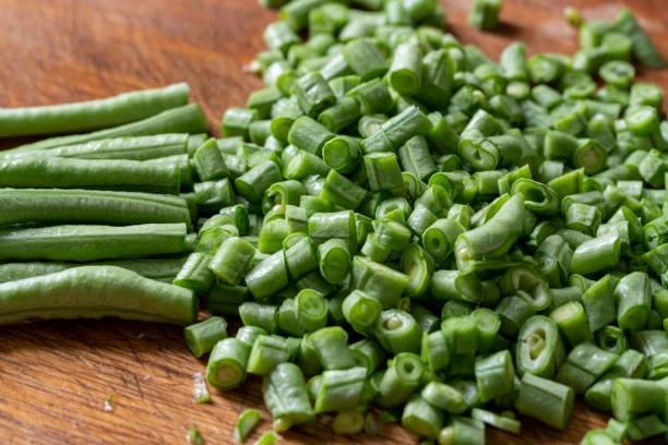 istock Cut green beans on wooden board 1213676365