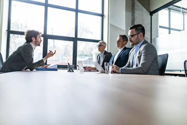 istock Human resource team talking to male candidate on a job interview. 1213676927