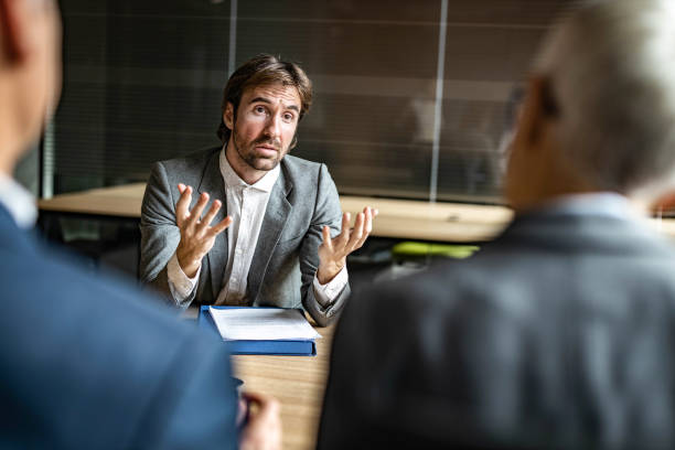 istock Young businessman talking to human resource team on a job interview. 1213677181