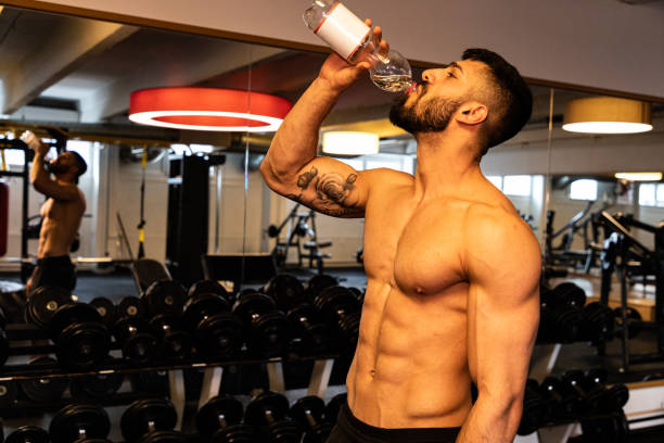 istock Drinking Water Young Man Taking a Break at Cross Training 1213678188