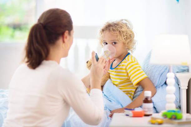 istock Sick little boy with asthma medicine. Ill child. 1213681243