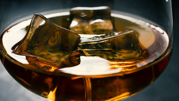 concrete table, ice cold, ice cubes, bourbon whiskey, whiskey scotch, shot glass