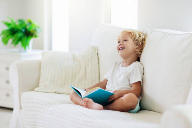 istock Child reading book. Kids read books. 1213683434