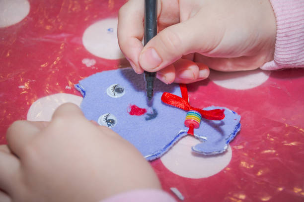 istock Create small cat gift .Learning lessons. Made by hand. Children's Art Project needlework crafts for children. Happy childhood 1213683705