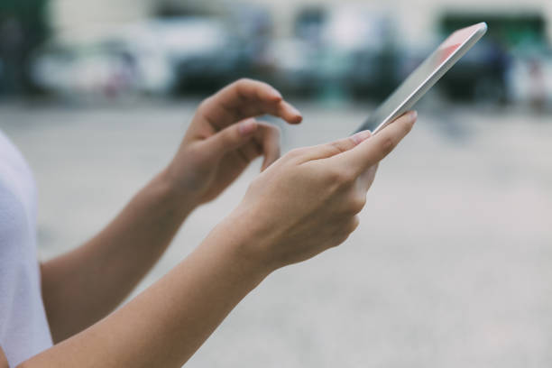 istock Side view of young woman using tablet 1213684854