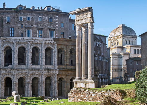 Detail of the Theatre of Marcellus in Rome, Italy. In the background right a detail of the Great Synagogue of Rome.