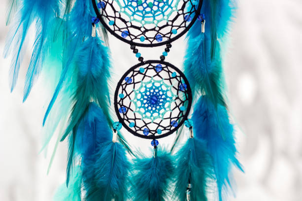 istock Handmade dream catcher with feathers threads and beads rope hanging 1213688314