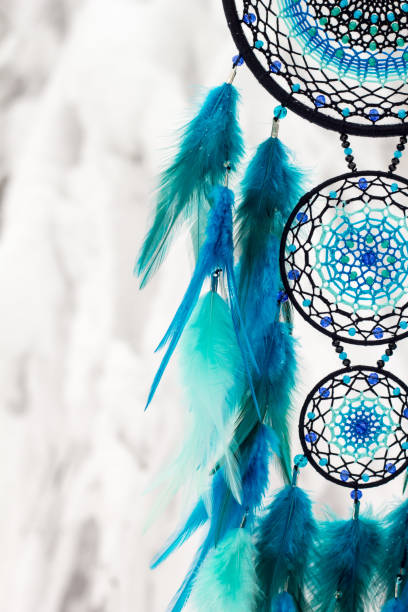 istock Handmade dream catcher with feathers threads and beads rope hanging 1213688324