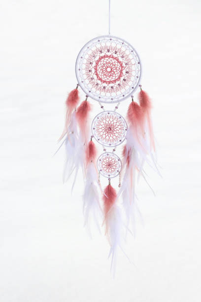 istock Handmade dream catcher with feathers threads and beads rope hanging 1213688359