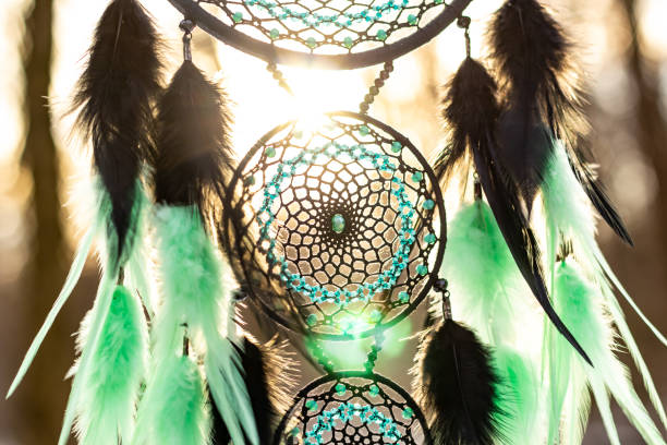 istock Handmade dream catcher with feathers threads and beads rope hanging 1213688368