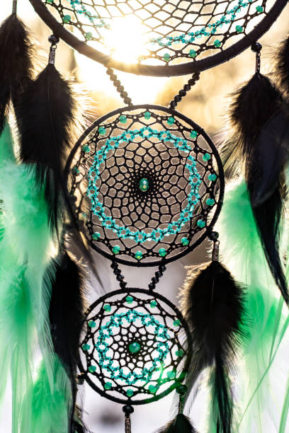 istock Handmade dream catcher with feathers threads and beads rope hanging 1213688407