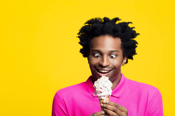 istock Surprised young man holding vanilla gelato 1213689115