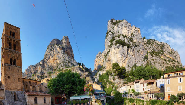 Church and chapel of the medieval village Moustiers Sainte Marie Moustiers Sainte Marie, France - Jul 4, 2019: Church and chapel of the medieval village Moustiers Sainte Marie. Village is included in list of "The most beautiful villages of France" sainte marie stock pictures, royalty-free photos & images