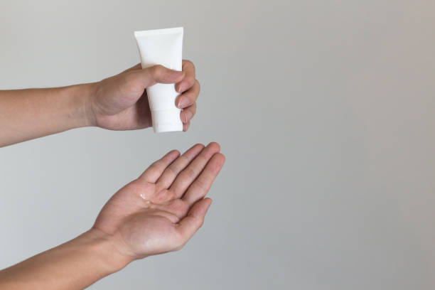 istock using cleaning gel for hands close-up, covid-19 and coronavirus. 1213690232