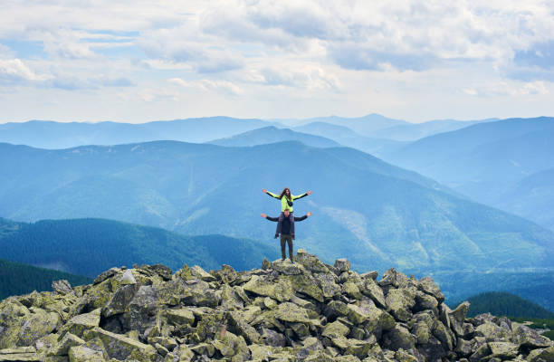 istock Tourists couple posing in mountains. 1213691212