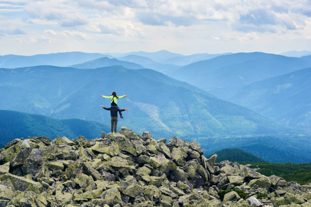 istock Tourists couple posing in mountains. 1213691261