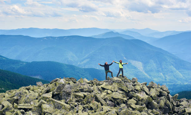 istock Tourists enjoying mountains scenery together. 1213691285