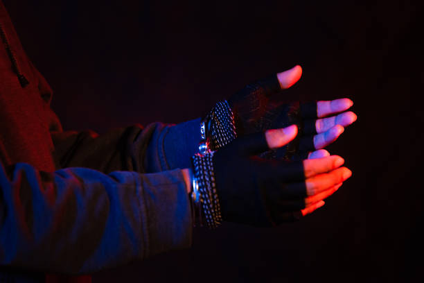 istock Men with handcuffs in front on black background.close-up view 1213691562