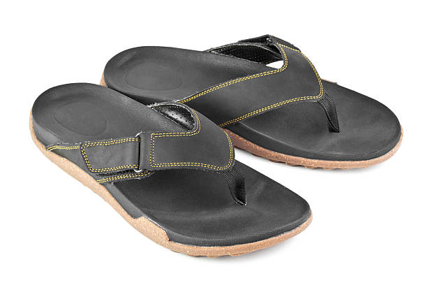 istock pair of black flip flops isolated on white background 121369188